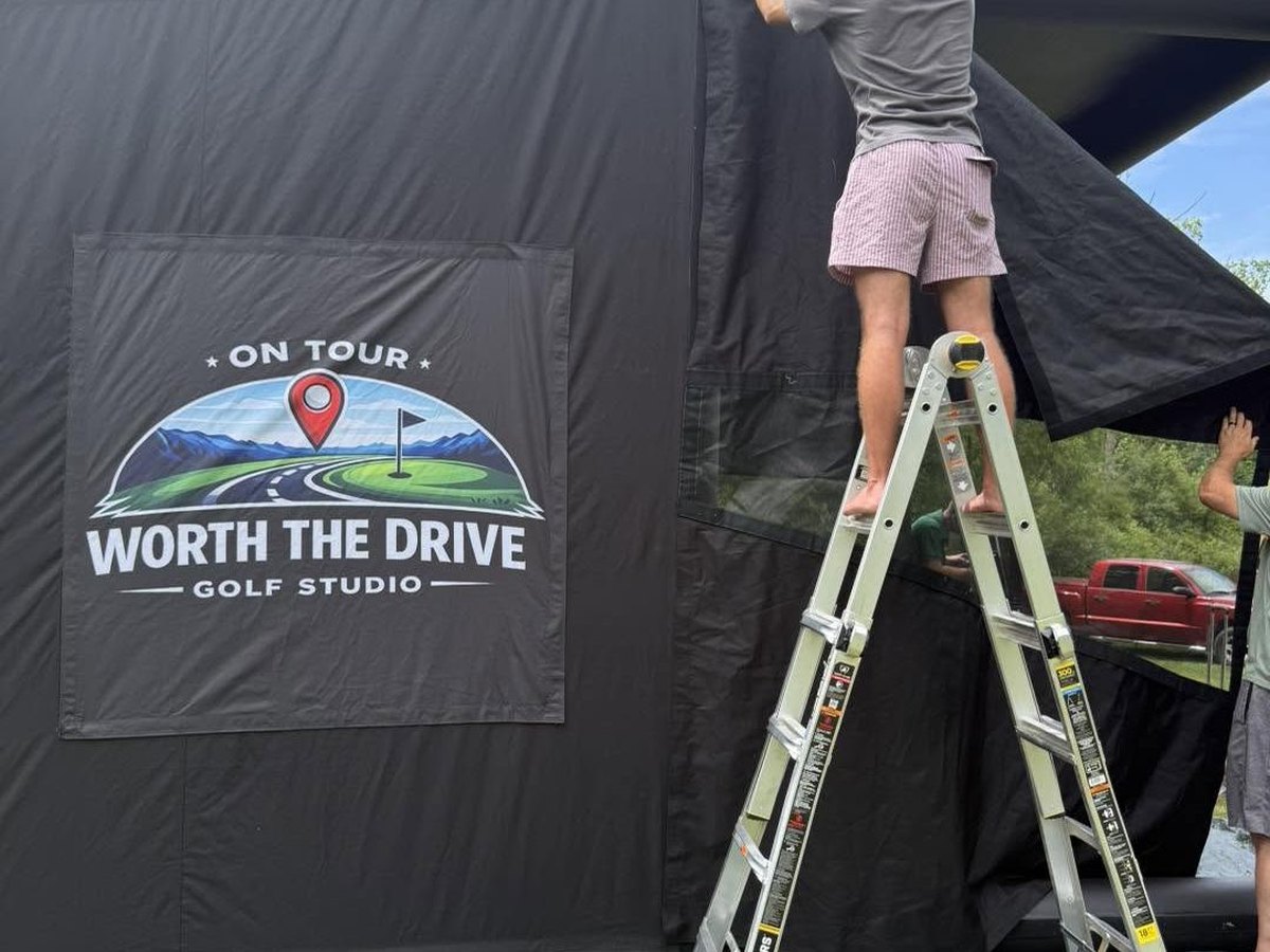 The Worth the Drive team setting up the mobile simulator enclosure